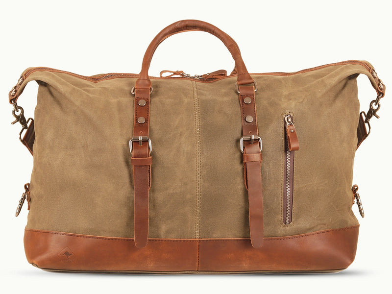 Produktbild föreställande duffelväska av modellen Kensington  i beige kanvas med detaljer i läder från varumärket Scippis