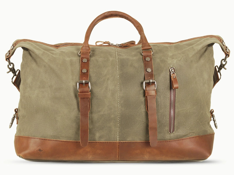 Produktbild föreställande duffelväska av modellen Kensington  i olivgrön kanvas med detaljer i läder från varumärket Scippis